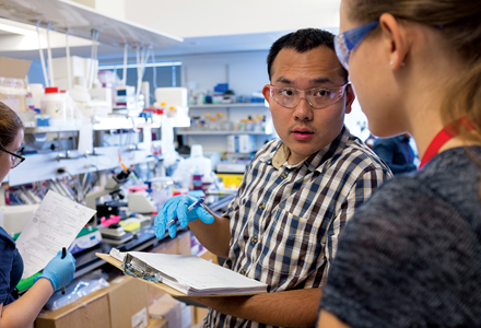 Two people having a conversation in a lab environment